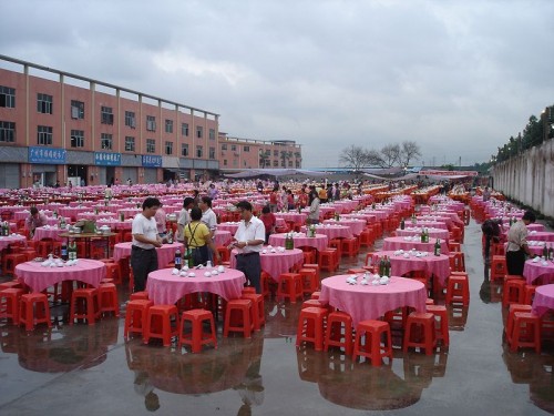 Lots of empty tables waiting for their wedding banquet guests