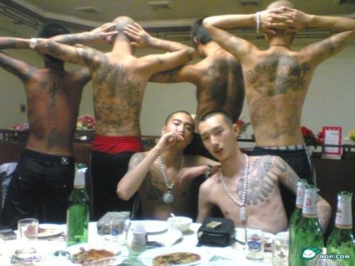 Chinese gang showing off displaying their tattoos?
