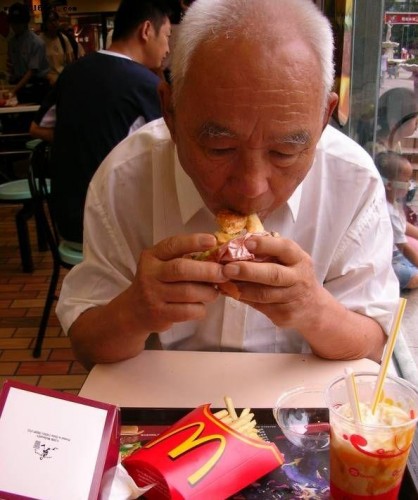 Chinese grandfather eats McDonald's for the first time.