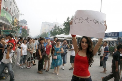 Pretty foreigner girl in Beijing holds sign: Please give me a hug