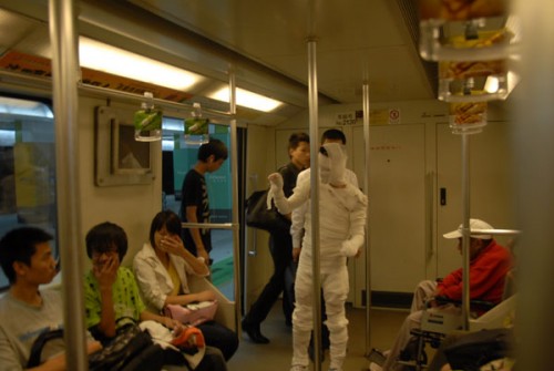 Chinese mummy scares other subway passengers. 
