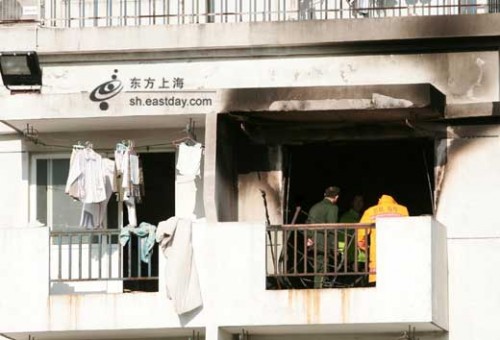 Room 602 of a girl's dormitory at Shanghai Business University with black smoke stains after fire.