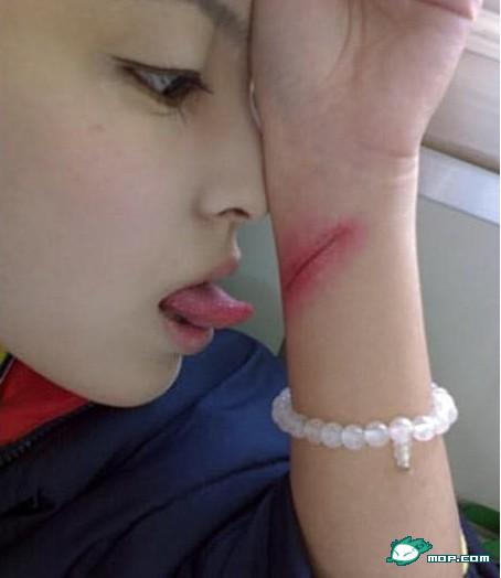 Chinese girl licks her slit wrist