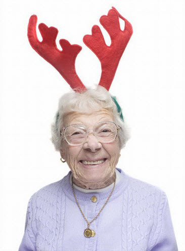 Crazy old lady wearing reindeer antlers.