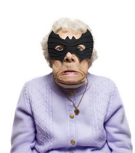 Crazy old lady wearing bat face mask.