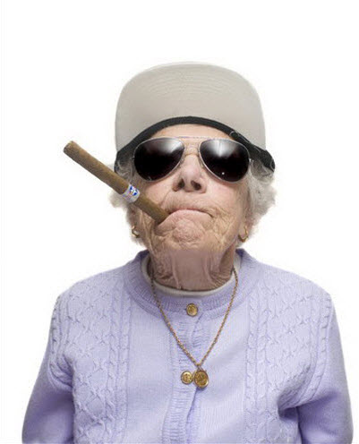 Crazy old lady wearing sunglasses and smoking a cigar.