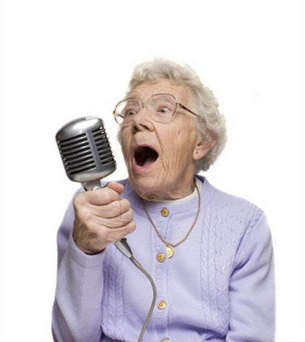 Crazy old lady singing into microphone.