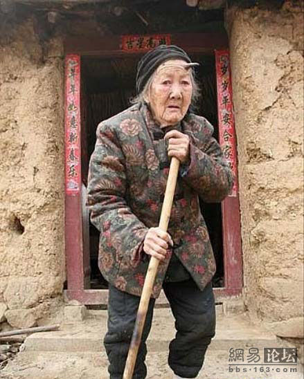 Henan, China, 101-year-old Zhang Ruifang sweeping the ground.