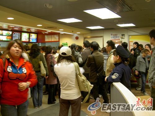 Crowd of upset Chinese customers at a KFC in Shanghai, China.