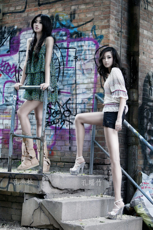 Kong Yansong and Kong Yaozhu, long-legged Chinese beauties, with graffiti background.