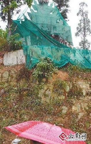 Kunming graves covered with green netting/cloth.