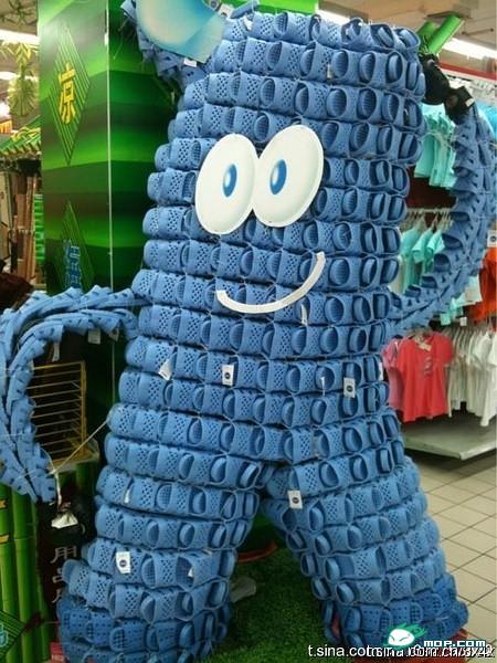 An amusing supermarket product display for blue slippers that looks like the 2010 Shanghai World Expo mascot, Haibao.