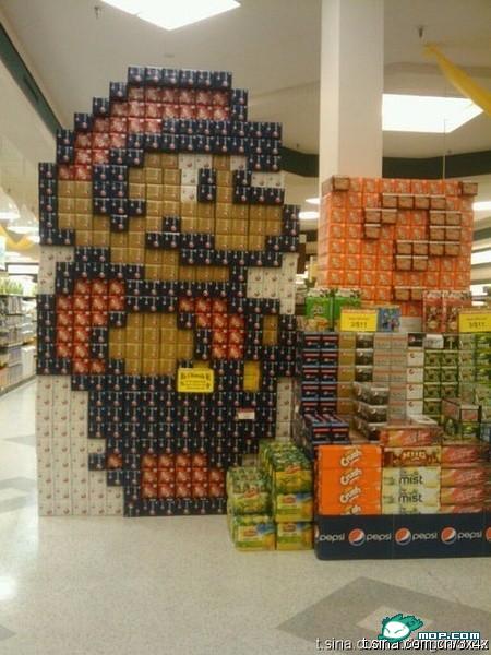 An incredible Super Mario supermarket product display made from cases of Pepsi, Crush, Sierra Mist, Mugs, Lipton's, etc.