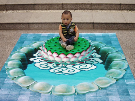 3D chalk art: child sitting on a lily pad and clouds?
