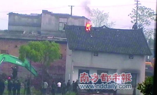 Chinese man protests forced eviction and demolition of home with self-immolation.