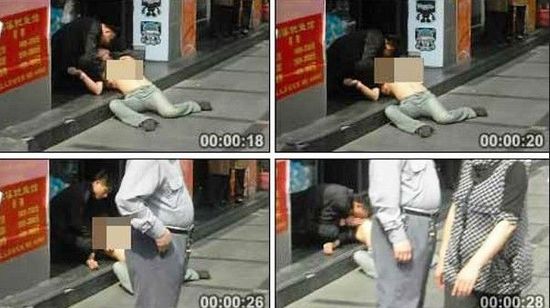 Screen captures of a video showing a drunk man and woman engaging in sexual acts in public in Shanghai.