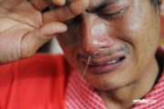 Yang Wu, a husband who hid while his wife was beaten and raped cries.